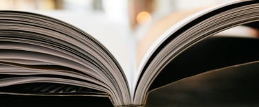 a book opened to show a book with a bookmark