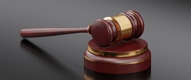 A gavel on a grey background representing legal translations