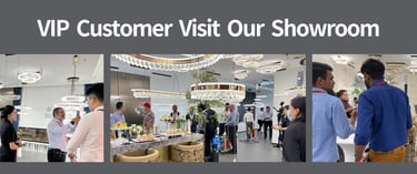 a group of LED lighting buyers standing around a table with a man in a suit and tie