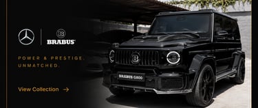 Custom black Brabus G800 Mercedes-Benz G-Wagon luxury SUV in a showroom with premium branding.