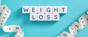 White blocks spelling weight loss surrounded by a white measuring tape on a blue background.