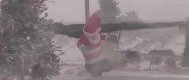 Inflatable Santa in snow storm