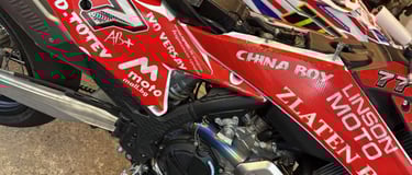 a motorcycle with a red and white motorcycle with a red and white motorcycle