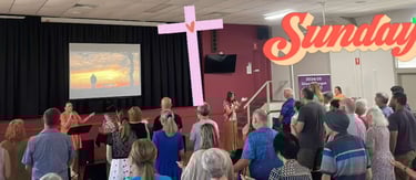 People in church, singing worship songs