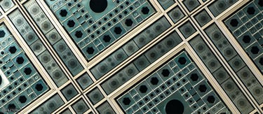 Adjustable façade lenses of the Institut du Monde Arabe shimmering in daylight, inspired by Arabic geometry.