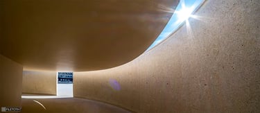 Daylight shifting through the cruise terminal’s passage by Carrilho, creating warm tones that turn transit into calm.