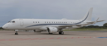 Embraer Lineage 1000 parked on the ramp waiting for it's next client