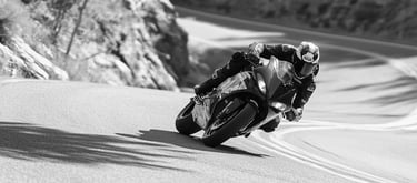 A motorcycle taking one of a number of corners