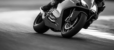 A view of motorcycle wheels as they take a left hand corner