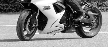 A suzuki GSXR in a car park riding slowly