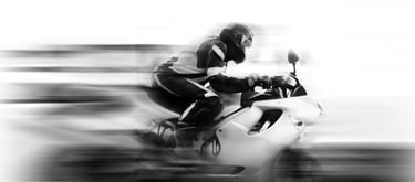 Blurred image of motorcycle to give illusion of speed