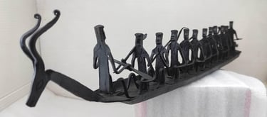 "Handmade Bastar Tribal Iron Boat-with Deer Head and 10 Seated Figures–Left Side View-Export-standard"