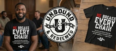 A man wearing a black Christian t-shirt with He Breaks Every Chain verse and Unbound and Redeemed logo.