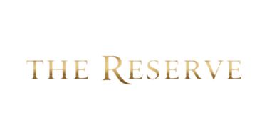 Elegant gold serif typography for The Reserve logo on a solid black background.