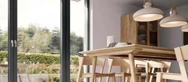 a dining room with a table and chairs