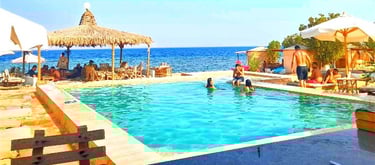 People in the pool with sea view at Bedouin star Ras shitan Nuweiba Egypt
