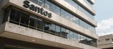Modern exterior of a commercial building in Santos, Brazil, under clear daylight, reflecting a professional atmosphere.