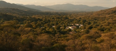 A panoramic photography of the beautiful landscapes around San Alfonso, Villavieja, Huila, showing the warm tropical dry forest and a glimpse of the community architecture.