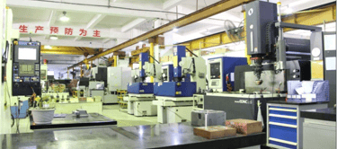 Precision CNC milling machines and EDM equipment in a modern industrial manufacturing workshop facility.