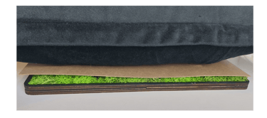 a pillow on a pillow with a green grass