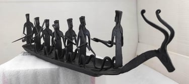 "Bastar tribal iron sculpture featuring deer-head boat and seated villagers – right view-Designed for export"