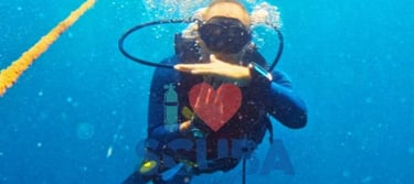 Scuba Duka Diani Beach Kenya scuba diving gift voucher featuring a diver underwater and SSI Basic Diver logo.