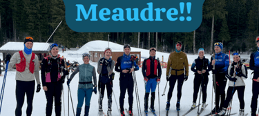 a group of people standing in front of a ski slope