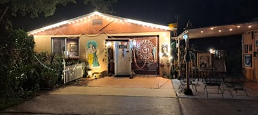 An evening photo of the exterior of the main sanctuary with Sri Sri Radha Vrndaban Chandra inside