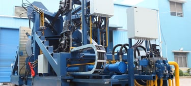 Side view of a wire rod bundling machine used in steel mill finishing lines