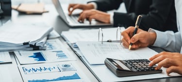 People Calculating and Writing