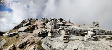 Chandrashila Summit among clouds, Uttarakhand Himalayas, panoramic mountain views.