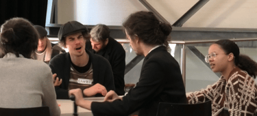 a group of people sitting at a table