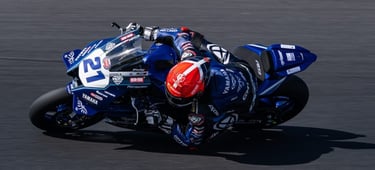 a person riding a motorcycle on a track