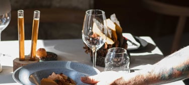 a man is holding a plate with food on it
