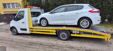 holowanie pojazdu do warsztatu lawetą pomoc drogowa SAFECAR