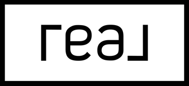 a black and white sign that says, 'real'