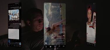 a man is laying in bed and holding a cell phone with social media apps running in front
