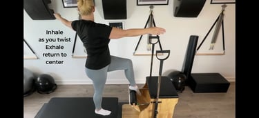 a woman working with the Pilates chair