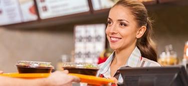 a waitress at a restaurant with a customer