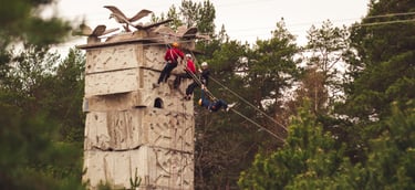people climbing on a climbing tower