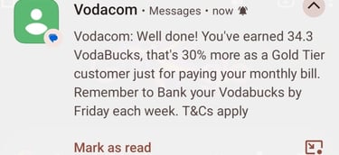 A mobile phone notification from Vodacom detailing VodaBucks rewards earned for paying a monthly bill.