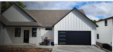 Custom black garage door with windows, Installed by On Point overhead doors In Austin TX