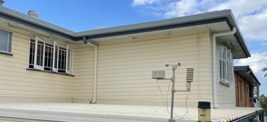Before exterior repainting in Zillmere showing weathered house exterior and wall surfaces