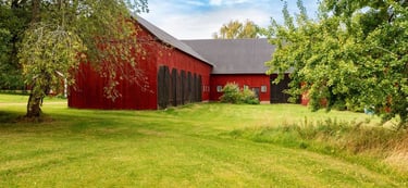 Large farm building painted with breathable heritage exterior wood paint