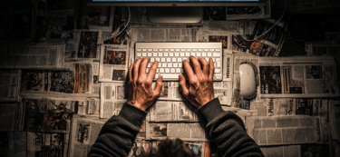 a person typing on a keyboard with a keyboard