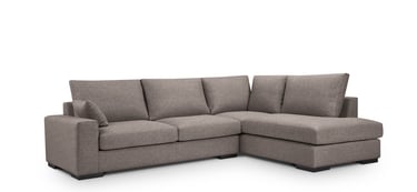 a couch with a chaisette and pillows