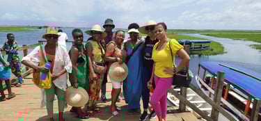 Haitian Diasporas visiting Ganvie Stilt Village in Benin during A multi-country tours