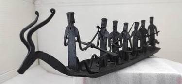 "Traditional Bastar forged iron boat with seven figures and deer head – left side view-Meant for export"
