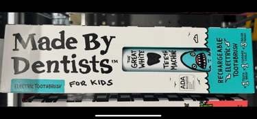 kids rechargeable toothbrush with cartoon shark design.