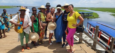 Haitian Diasporas visiting Ganvie Stilt Village in Benin during A multi-country tours